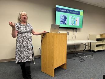 woman presenting speakers bureau program